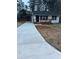 Newly renovated home with a long driveway and modern deck at 1840 Judy Se Cir, Marietta, GA 30060