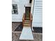 Side entrance with wooden steps and railing leading to the front door at 1840 Judy Se Cir, Marietta, GA 30060