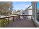 Wooden back deck overlooking a spacious fenced yard with mature trees at 4974 Dovecote Trl, Suwanee, GA 30024