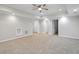 Spacious basement with multiple rooms and neutral carpeting at 4974 Dovecote Trl, Suwanee, GA 30024