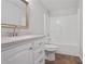 Clean bathroom with a vanity, toilet, and shower-tub combo at 4974 Dovecote Trl, Suwanee, GA 30024