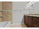 Bathroom with tile shower, granite countertop vanity and dark wood cabinets at 4974 Dovecote Trl, Suwanee, GA 30024