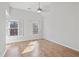 Well-lit bedroom with hardwood floors and plantation shutters at 4974 Dovecote Trl, Suwanee, GA 30024