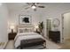 Comfortable bedroom with neutral colors, ample lighting, and walk-in closet at 4974 Dovecote Trl, Suwanee, GA 30024