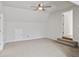 Spacious bonus room with vaulted ceiling and light gray carpet at 4974 Dovecote Trl, Suwanee, GA 30024