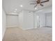 Spacious bonus room featuring neutral carpet and recessed lighting at 4974 Dovecote Trl, Suwanee, GA 30024