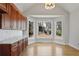 Bright breakfast nook with hardwood floors and large windows offering natural light at 4974 Dovecote Trl, Suwanee, GA 30024