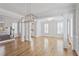 Bright dining room with hardwood floors and a chandelier at 4974 Dovecote Trl, Suwanee, GA 30024