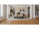 Formal dining room with hardwood floors, modern lighting, and elegant decor at 4974 Dovecote Trl, Suwanee, GA 30024