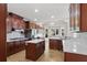 Spacious kitchen featuring an island, stainless steel appliances, and ample cabinetry at 4974 Dovecote Trl, Suwanee, GA 30024