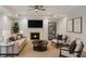 Finished basement with modern fireplace, mounted TV, and neutral color scheme at 4974 Dovecote Trl, Suwanee, GA 30024