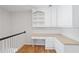 Upstairs landing featuring built-in white desk and cabinet storage at 4974 Dovecote Trl, Suwanee, GA 30024