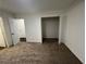 Well-lit bedroom with a roomy closet and access to another room at 114 Jousters Ln, Lawrenceville, GA 30044