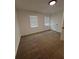 Bright bedroom with neutral walls and carpeted floors at 114 Jousters Ln, Lawrenceville, GA 30044