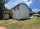 White two story home with black accents and elevated deck at 114 Jousters Ln, Lawrenceville, GA 30044