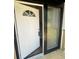 Open white front door with sidelights at 114 Jousters Ln, Lawrenceville, GA 30044