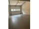 Attached garage with epoxy coated floor at 114 Jousters Ln, Lawrenceville, GA 30044