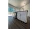 Modern kitchen island with white cabinets, stainless steel appliances, and quartz countertops at 114 Jousters Ln, Lawrenceville, GA 30044