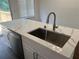 Quartz kitchen island with sink and faucet at 114 Jousters Ln, Lawrenceville, GA 30044