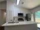 Modern kitchen with stainless steel appliances and white cabinets at 114 Jousters Ln, Lawrenceville, GA 30044