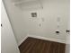 Laundry closet with hookups and ample shelving at 114 Jousters Ln, Lawrenceville, GA 30044