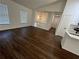 Open and bright living room with hardwood floors and large windows at 114 Jousters Ln, Lawrenceville, GA 30044