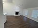 Living room with hardwood floors and a fireplace at 114 Jousters Ln, Lawrenceville, GA 30044