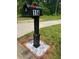 Black post mailbox with address number 114 at 114 Jousters Ln, Lawrenceville, GA 30044