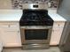 Stainless steel gas range with five burners and large oven at 6735 Pole Creek Dr, Lithonia, GA 30058