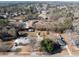 Aerial view of a neighborhood with houses and a pond at 3170 New Macland Rd, Powder Springs, GA 30127
