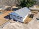 Aerial view of a ranch house with gray roof, fenced yard, and driveway at 3170 New Macland Rd, Powder Springs, GA 30127