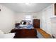 Bedroom with a double bed, wooden dresser, and fireplace at 3170 New Macland Rd, Powder Springs, GA 30127