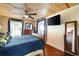 Bedroom with a wooden bed frame, dresser, and wood floors at 3170 New Macland Rd, Powder Springs, GA 30127