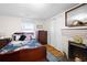 Charming bedroom with a double bed, wooden dresser, and fireplace at 3170 New Macland Rd, Powder Springs, GA 30127