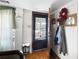 Bright entryway with hardwood floors and coat rack at 3170 New Macland Rd, Powder Springs, GA 30127