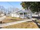 Side view of a charming white cottage with a large yard at 3170 New Macland Rd, Powder Springs, GA 30127