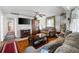 Living room features hardwood floors, built-in shelves and sofas at 3170 New Macland Rd, Powder Springs, GA 30127