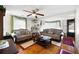 Spacious living room with hardwood floors and comfy sofas at 3170 New Macland Rd, Powder Springs, GA 30127