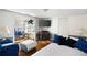 Main bedroom with comfy seating area and a queen-size bed at 3170 New Macland Rd, Powder Springs, GA 30127