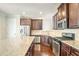 Modern kitchen with granite countertops and stainless steel appliances at 457 Raven Brook Ln, Suwanee, GA 30024