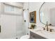 Stylish bathroom features a tiled shower with glass enclosure, marble countertop, and modern fixtures at 1055 Ormewood Se Ave, Atlanta, GA 30316