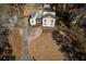 An aerial view of the home displaying the driveway, backyard, and wooden porch at 1775 Jody Ne Dr, Marietta, GA 30066