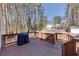 Cozy back deck features a grill, wood flooring, and overlooks a peaceful backyard at 1775 Jody Ne Dr, Marietta, GA 30066