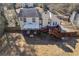 A view of the home's back exterior shows a well-maintained lawn and a wooden deck at 1775 Jody Ne Dr, Marietta, GA 30066