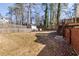 Large backyard with a wooden fence, foliage and steps leading to a deck at 1775 Jody Ne Dr, Marietta, GA 30066