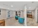 Finished basement area with tile floors, two accent chairs and view to the backyard at 1775 Jody Ne Dr, Marietta, GA 30066