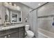 Bathroom featuring a tiled shower, granite countertops, and modern fixtures at 1775 Jody Ne Dr, Marietta, GA 30066