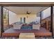 Covered patio featuring outdoor seating with ceiling fan and stairs to the left of the shot at 1775 Jody Ne Dr, Marietta, GA 30066