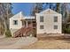 Two story home featuring brown accents, a walkway to the home and a mailbox in the yard at 1775 Jody Ne Dr, Marietta, GA 30066