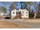 Inviting exterior of home featuring a wood deck and front yard with mature trees at 1775 Jody Ne Dr, Marietta, GA 30066